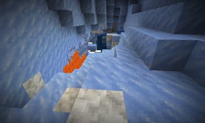 Minecraft冰洞熔岩湖场景，冰锥环绕的高风险洞穴