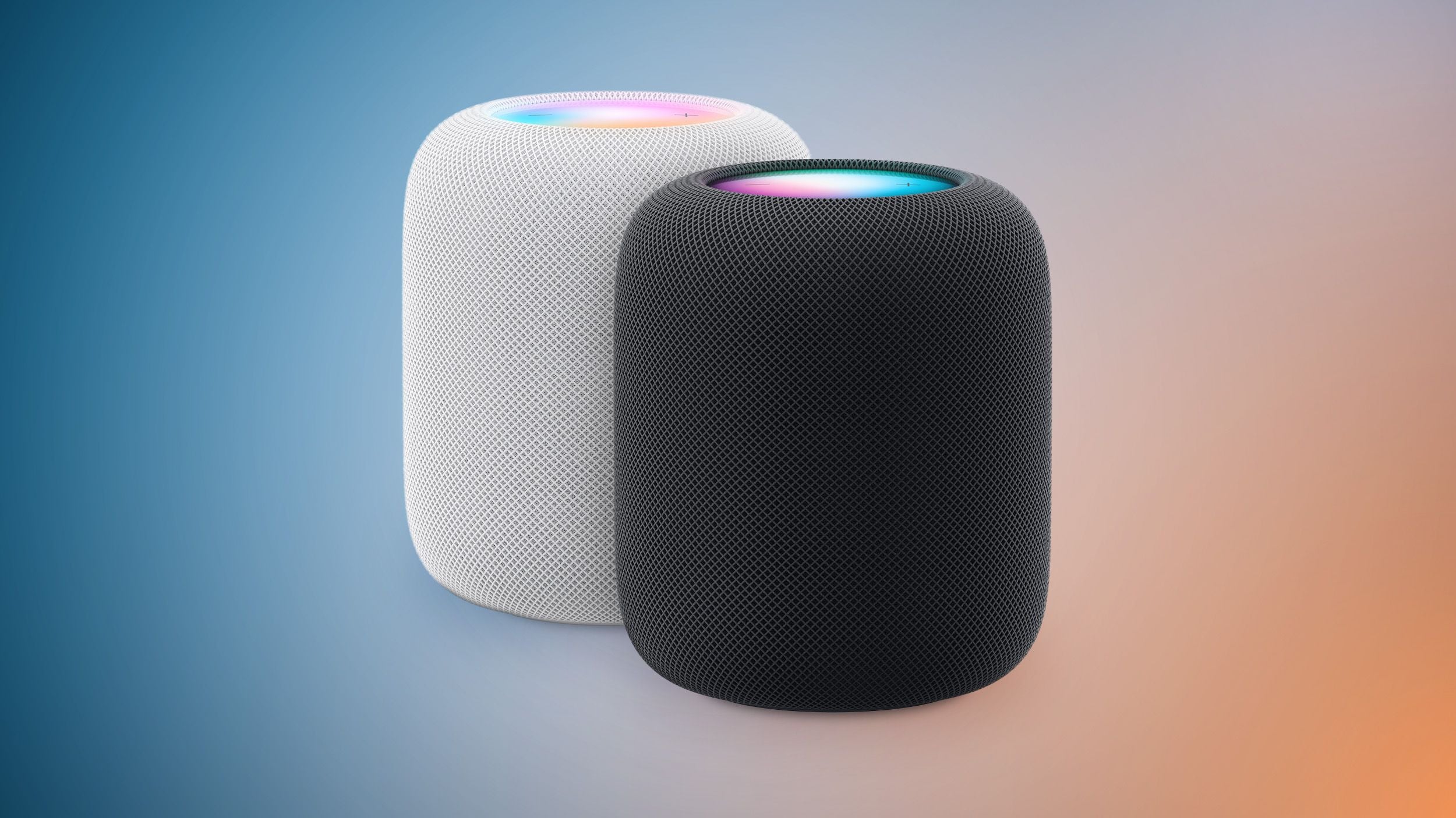 白色与深空黑两款 HomePod 2 并排摆放