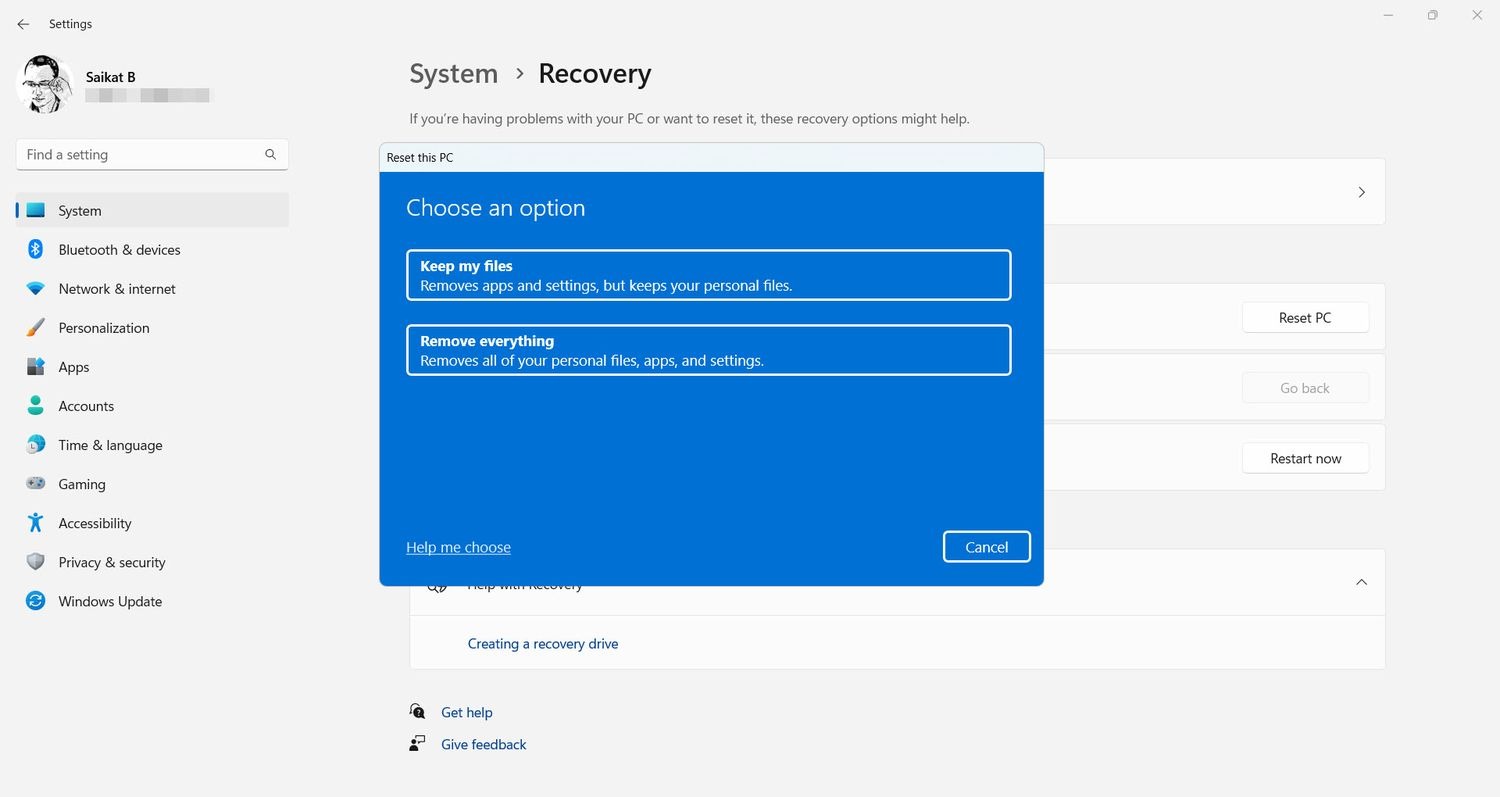 Windows 11 设置中的系统恢复页面,展示重置此电脑的选项窗口